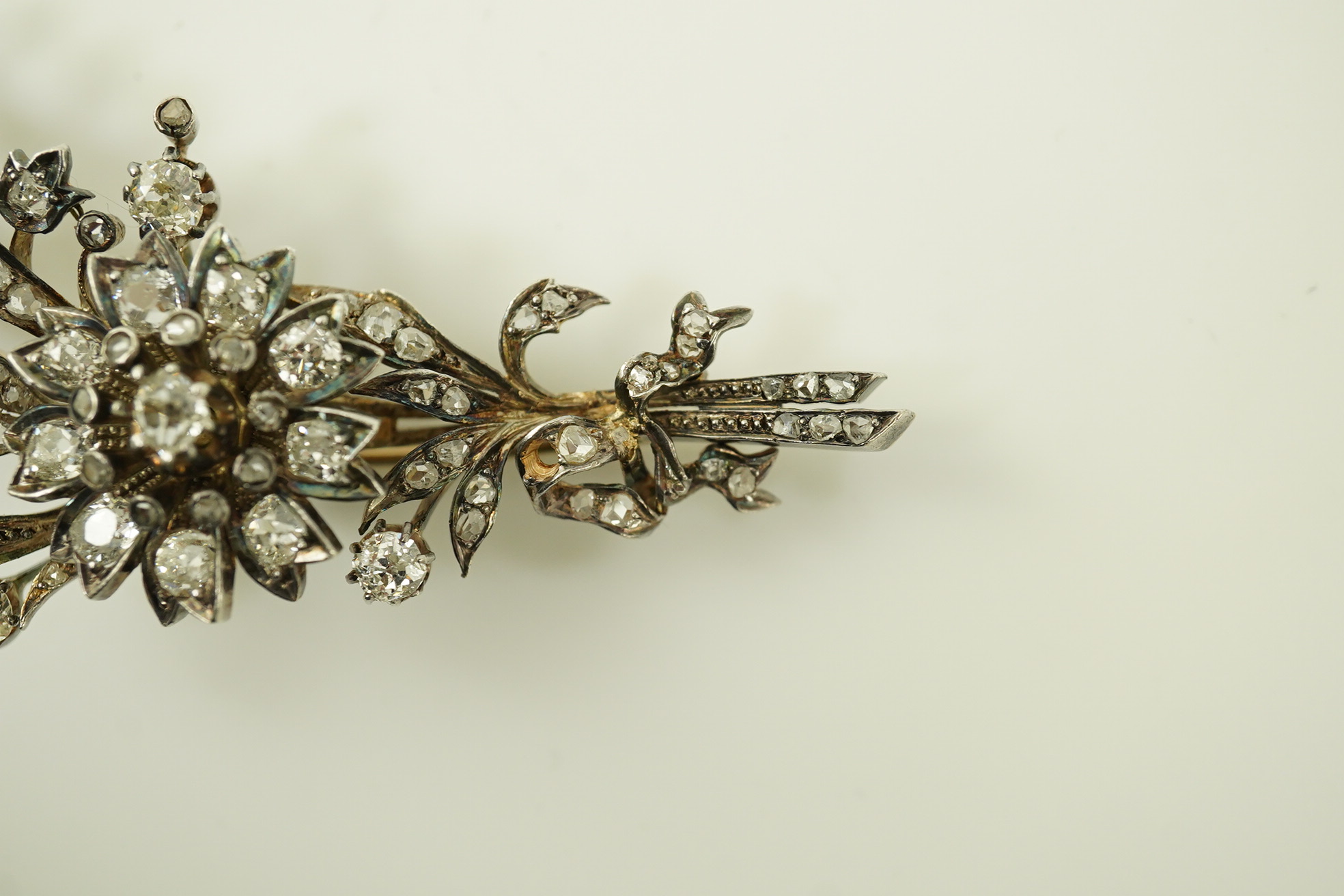 A Victorian gold, silver and diamond cluster foliate spray brooch